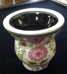 Mate made of glass with stainless steel top