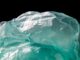 Blue plastic waste on black background, symbolizing the shift toward biodegradable alternatives