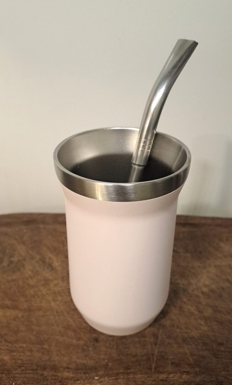 Stainless steel mate gourd on a wooden table